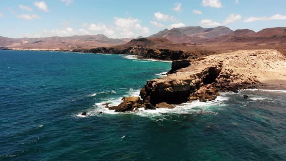 Aerial dron shot of the coast  La Pared in Fuerteventura on a sunny day. Majestic cliffs and the Atl