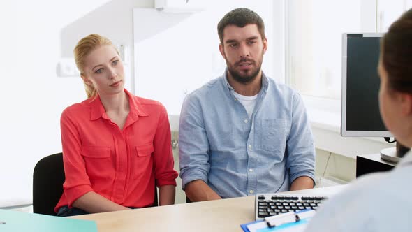 Couple Visiting Doctor at Family Planning Clinic