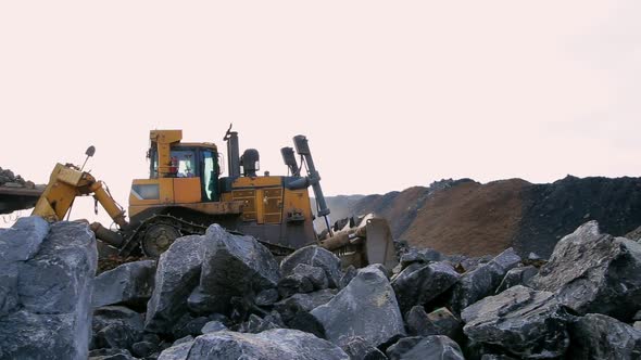 The Bulldozer Move the Stones and the Earth