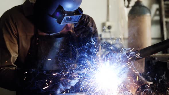 Welder welding a metal