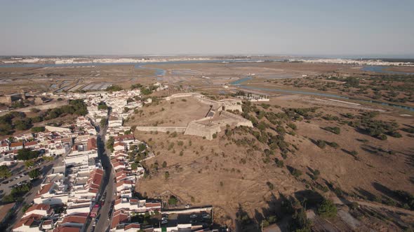 Aerial descending shot of Forte de Sao Sebastiao in Castro Marim, Algarve, Portugal.