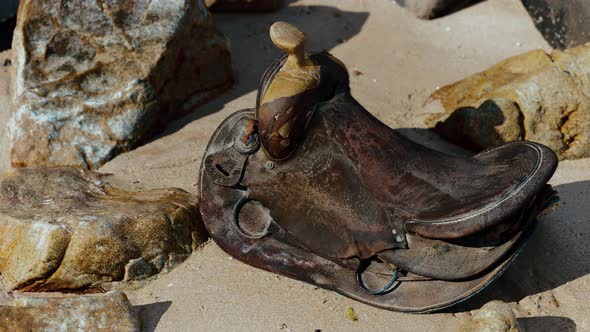 Very Old Horse Saddle on Sand Beach