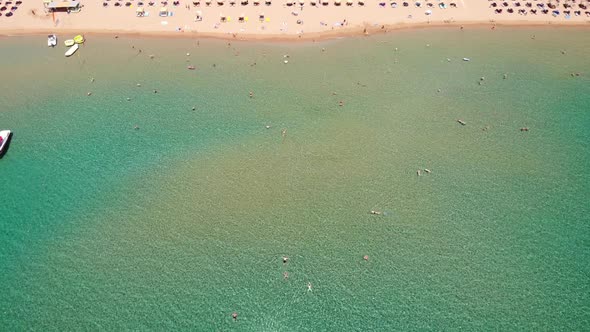 Aerial View Of Scenic Beach With Sunbeds And Umbrellas In Tsambika Beach, Rhodos Island, Greece - dr