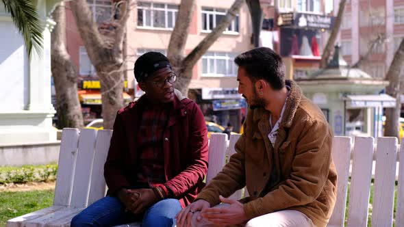 African Man Caucasian Talking