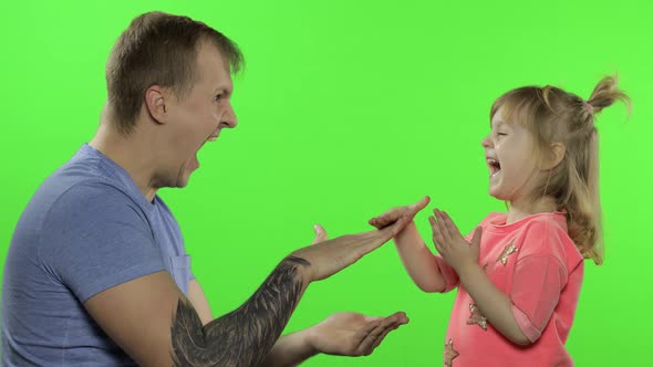 Father and Little Daughter Playing Rock Paper Scissors. Chroma Key. Leisure Game