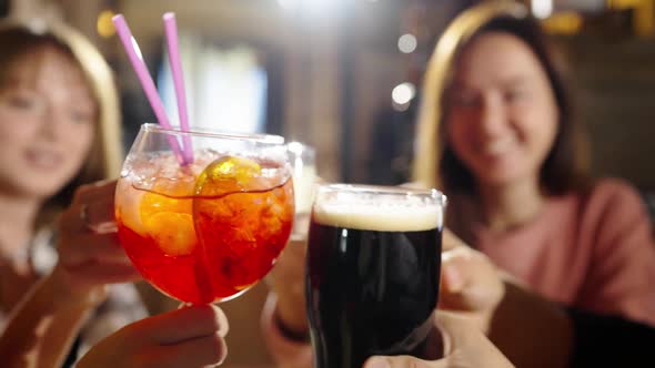 Group of Happy Multiethnic Friends Having Fun Together Drinking Bottled Beer in a Bar or at Home