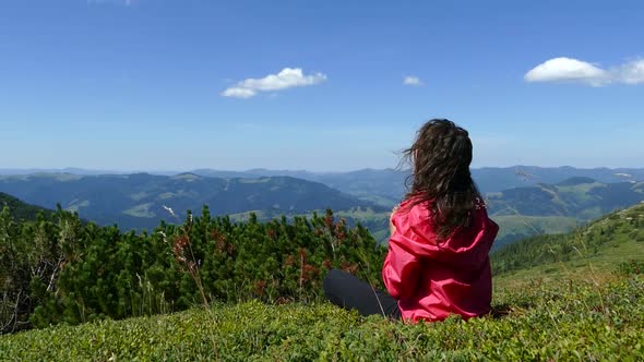 The Girl on the Top in the Mountains Is Resting Look at the Beautiful Landscape. Rest in Nature.