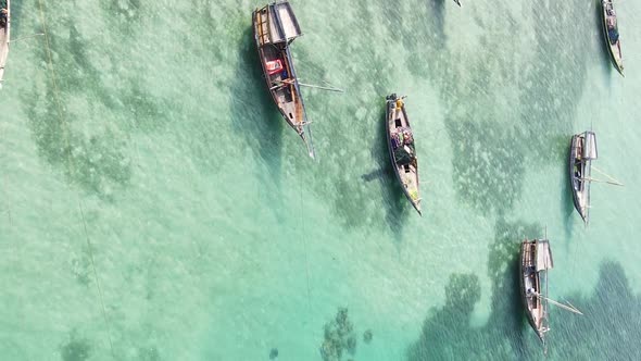 Vertical Video Boats in the Ocean Near the Coast of Zanzibar Tanzania Aerial View