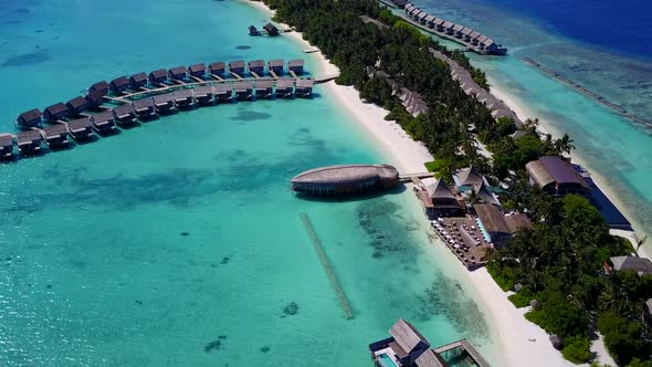 Aerial drone seascape of marine lagoon beach trip by blue sea and sand background