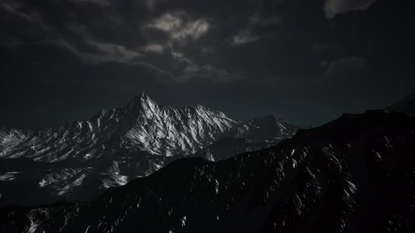 Mountains in Evening Cloudy Sky