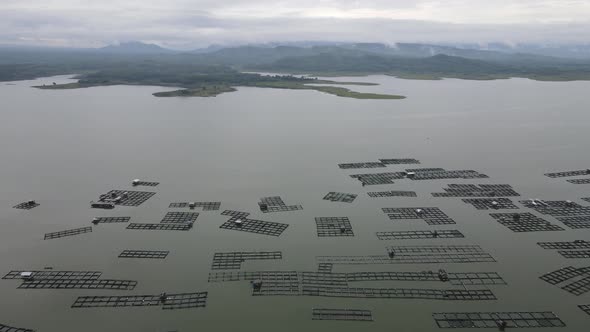 Aerial view of traditional floating fish pond on lake in Indonesia