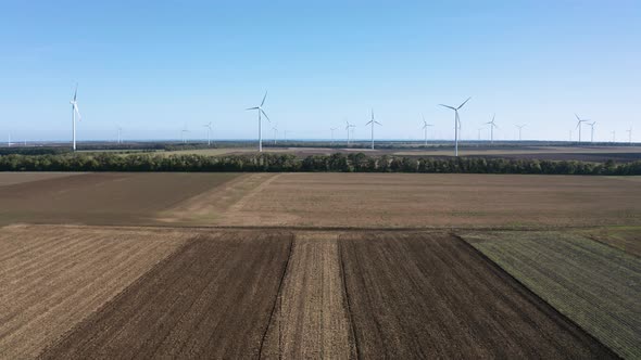 Wind turbines across agricultural field
