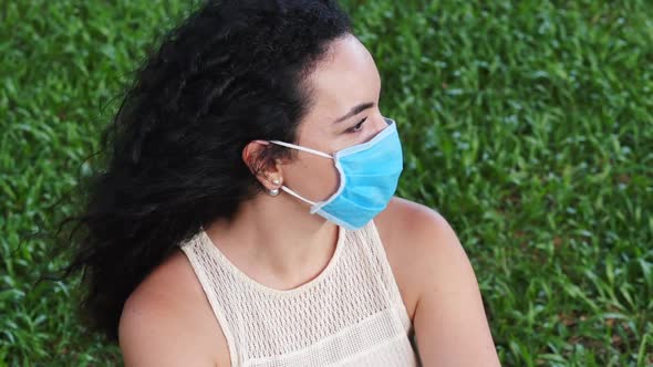 Portrait of a Young Student Woman Wearing a Protective Mask on the Park, Wearing a Ovid-19 Mask