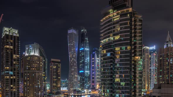 View of Various Skyscrapers and Towers in Dubai Marina From Above Aerial Night Timelapse