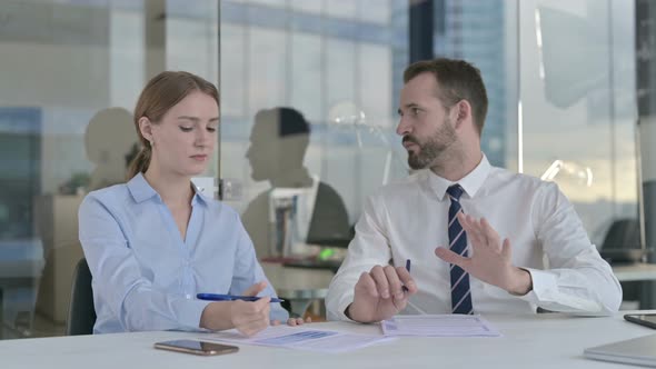 Business People Having Discussion in Board Room