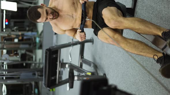 Shirtless Athlete Training Rowing Machine Exercise Intense Endurance Workout Slow Motion