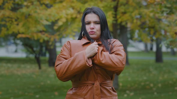 Closeup Young Hispanic Woman Standing in Autumn Park Outdoors Girl Frozen Shivering From Cold Trying