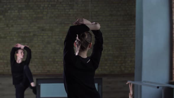 Elegant Dancer Training Hard in Empty Ballroom