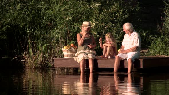 Grandparents and Kid Having Fun Outdoors.