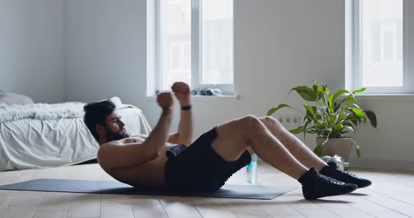 Young Man Practicing Crunches, Training Abdominal Muscles