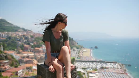 Young Woman in Background of Mediterranean Sea and Sky.