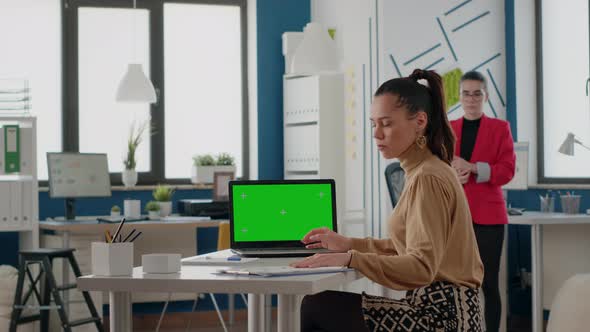 Business Women Working with Green Screen on Laptop