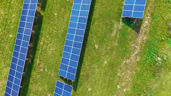 Photovoltaic solar panels. High angle view of solar panels on energy farm in rural