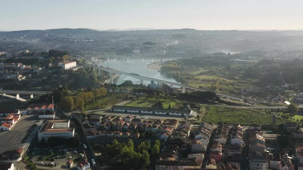 Aerial View of the City Train Running Between Banks of River Douro