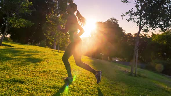 Athletic Woman Running Up A Hill Slow-Motion