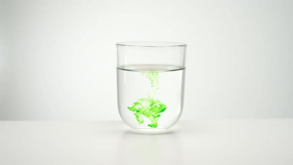 Paint Spreading In Liquid. Glass Of Water.