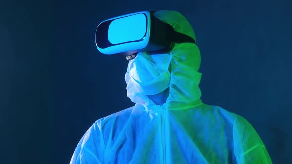 Scientist wearing virtual reality glasses and white protective clothing