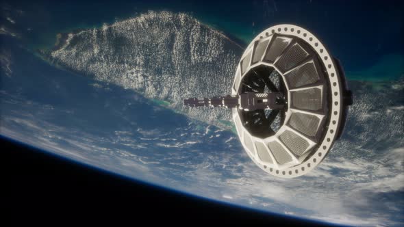 Futuristic Space Satellite Orbiting the Earth alt