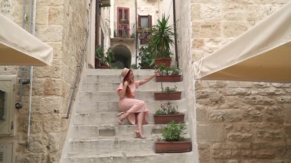 Happy Woman Tourist Takes Selfie on Streets of Old City Italy Puglia