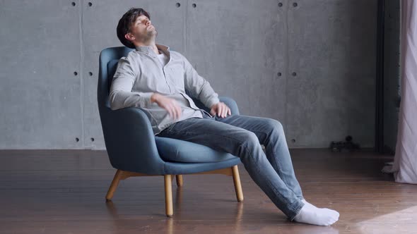 Happy Man Relaxing on Comfortable Armchair, Smiling Calm Relaxed Guy Lounge Eyes Closed in Sunny