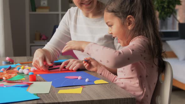 Daughter with Mother Making Applique at Home