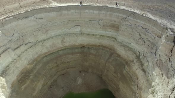 A Researcher Cave Enters a Deep Sinkhole Pit Cave