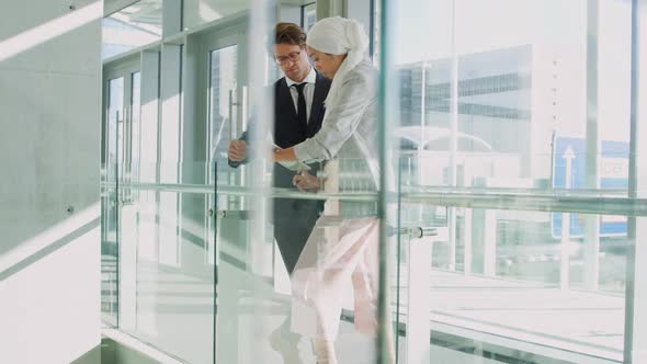 Young business people talking in a modern office building