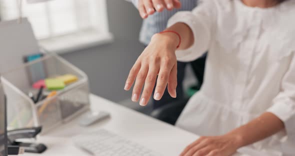 Hands of Different Nationalities Skin Colors Stacked One on Top of the Other Over the Office Desk an