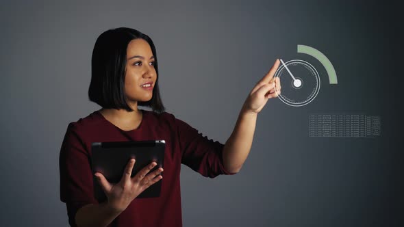 Young woman holds a tablet and uses a digital hologram touchscreen to create a network of connection