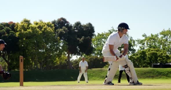 Wicket keeper taking a catch during cricket match