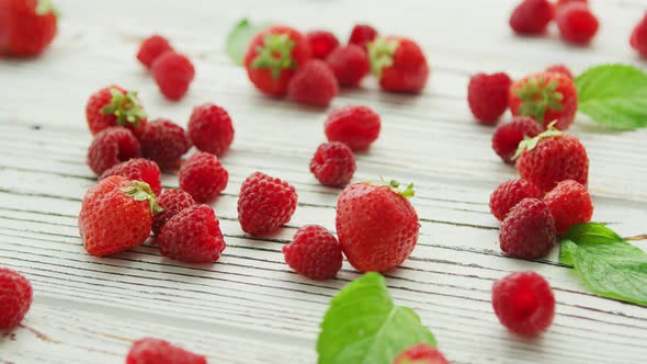 Raspberries and Strawberries on Table