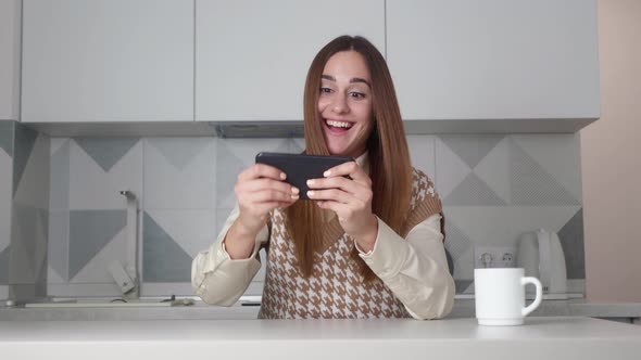 Woman Using Smart Phone Winning Concept Celebrating Success