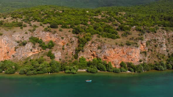 Aerial shot of Macedonia coast. Clif and beautiful water around Ohrid Lake in Southern Europe.