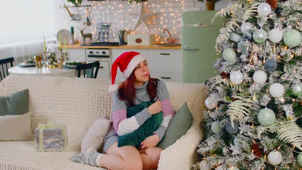 Woman Admiring Christmas Tree