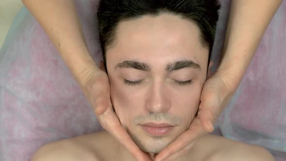 Facial Massage Young Handsome Man