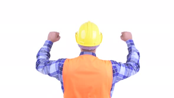 Rear View of Happy Bearded Persian Man Construction Worker with Fists Raised