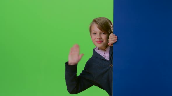 Child Boy Appears From the Side Board Waving Hand and Calling To His on a Green Screen