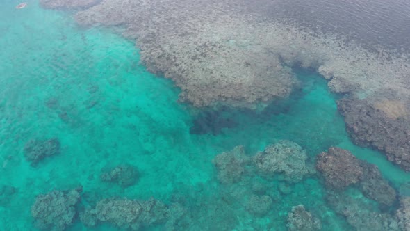 Coral reef in Natadola Bay of Fiji with crystal clear water, calm blue lagoon