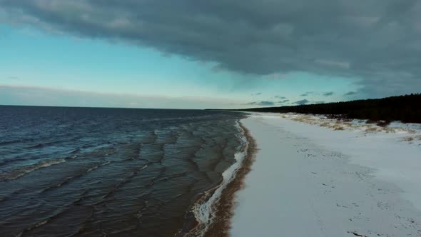 Aerial View at the Baltic Sea, Winter Season Landscape by the Sea in Sunny Day. Snowy Beach at Winte