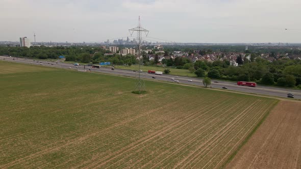 Autobahn A66 on a cloudy day with the skyline of Frankfurt am Main, Germany in the background. Aeria